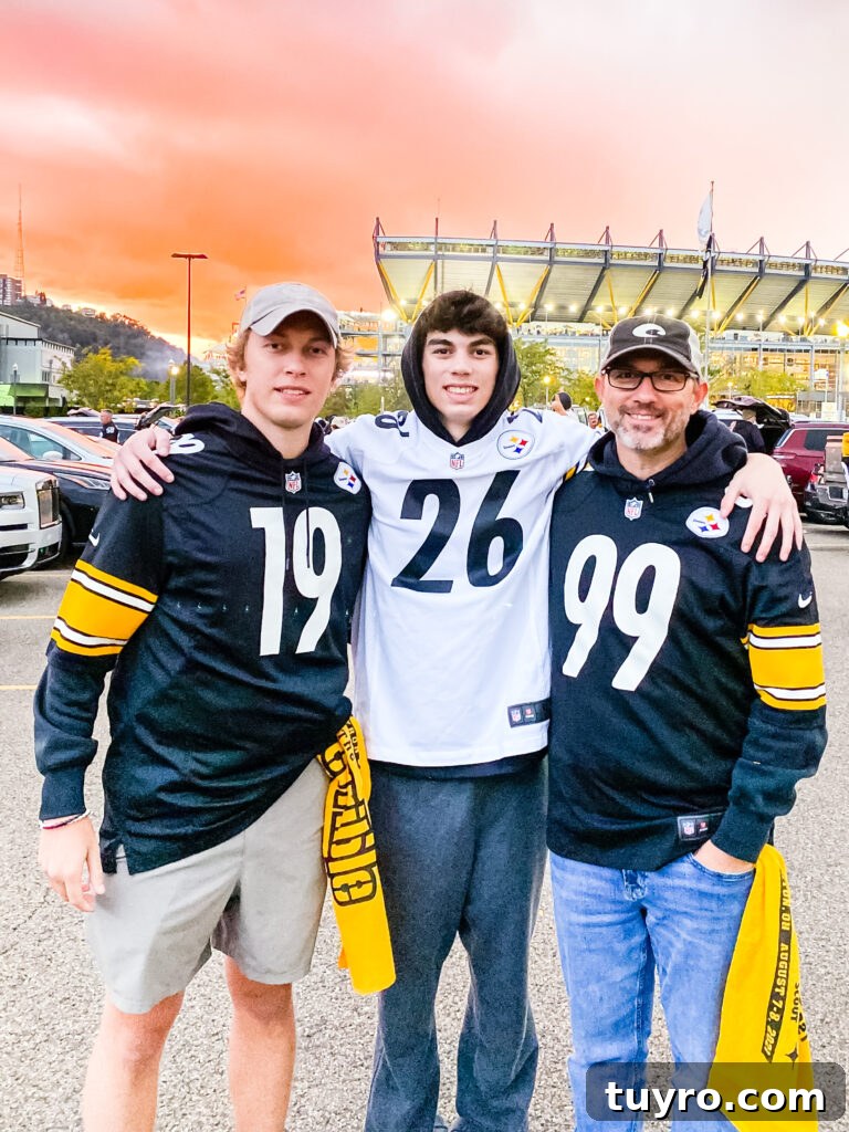 30+ Activities to Connect with Your Young Adult Children 16 Dad and two sons wearing Steelers jerseys at a football game with stadium in the background, sharing a memorable sports gift experience.