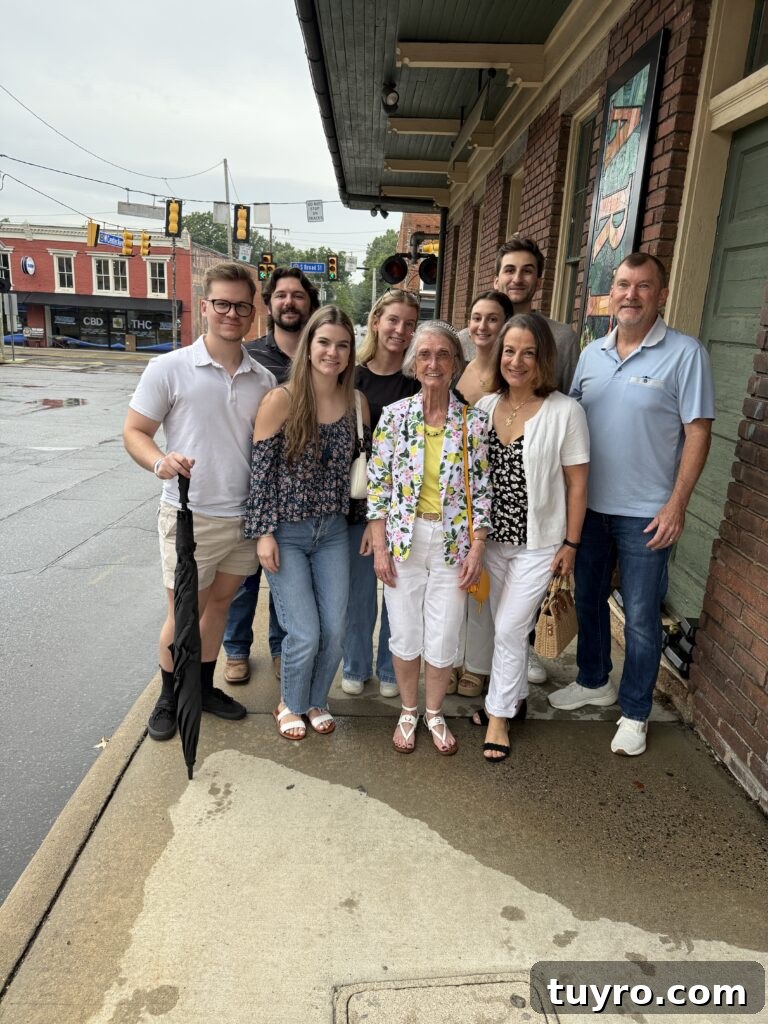 30+ Activities to Connect with Your Young Adult Children 20 Large family group smiling together on a sidewalk after a birthday dinner outing, celebrating milestones with young adult children and grandparents.