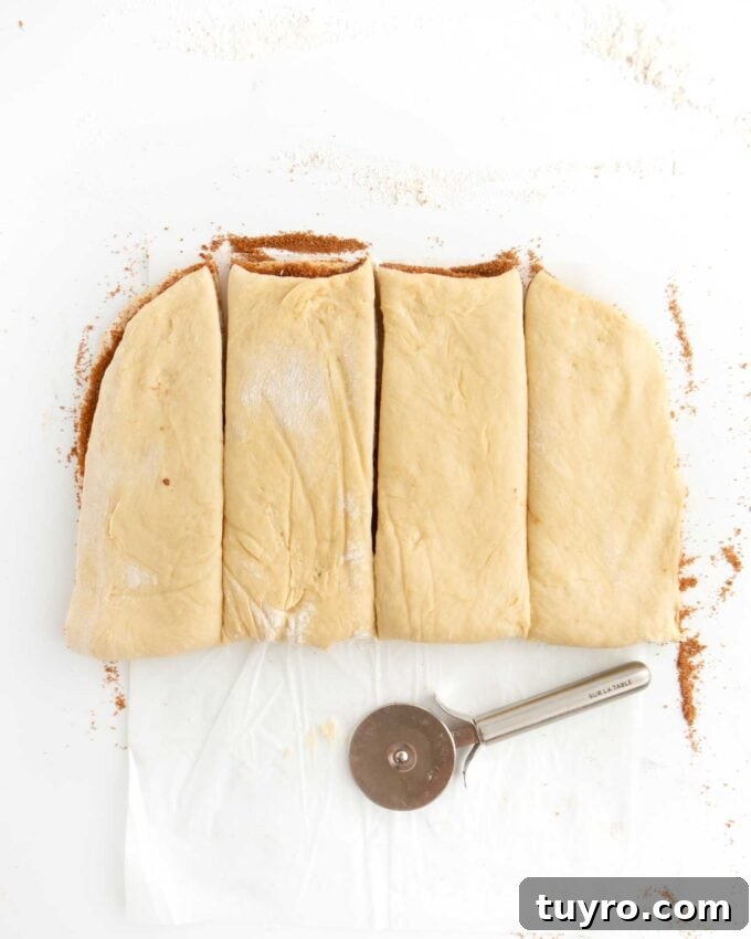 cinnamon roll dough cut in four pieces