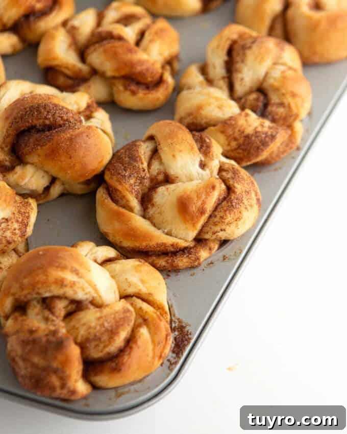 unbaked cinnamon roll muffin dough brushed with milk