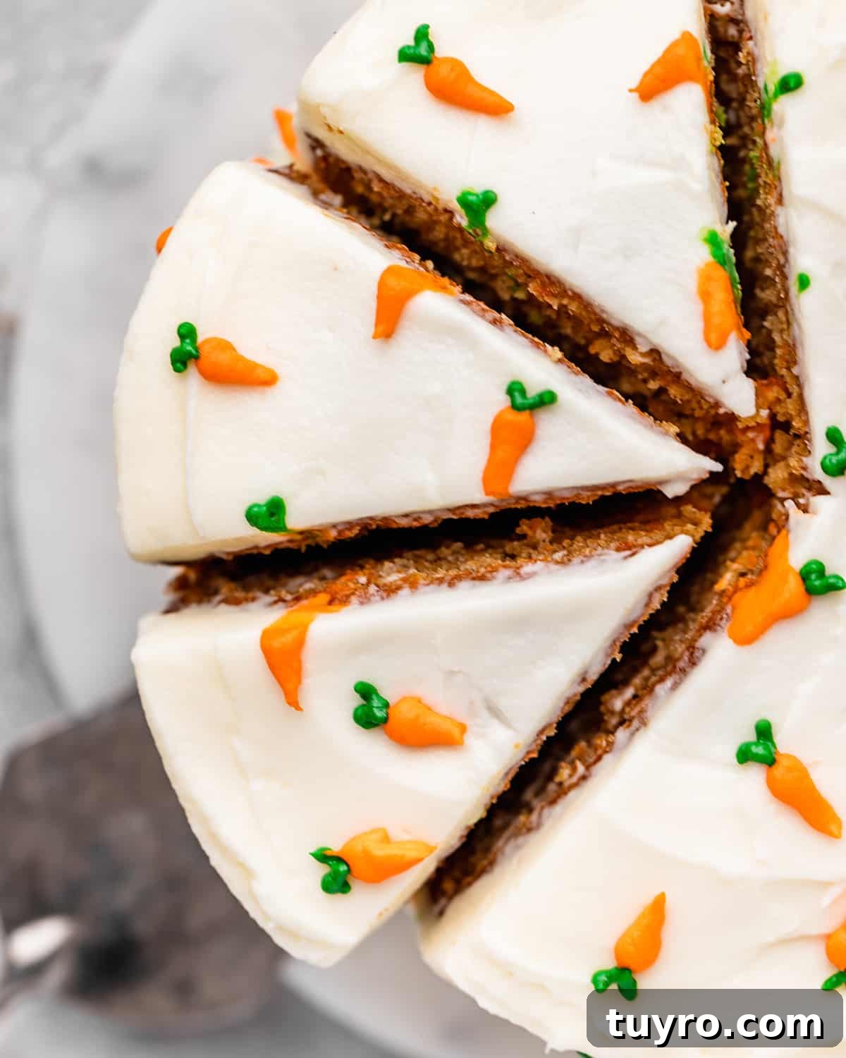 Moist Carrot Cake Recipe with Cream Cheese Frosting 16 3 slices cut out of a carrot cake
