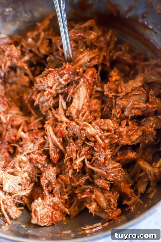 BBQ Pulled Pork Sliders with Crisp Apple Coleslaw 6 BBQ pulled pork in a large bowl