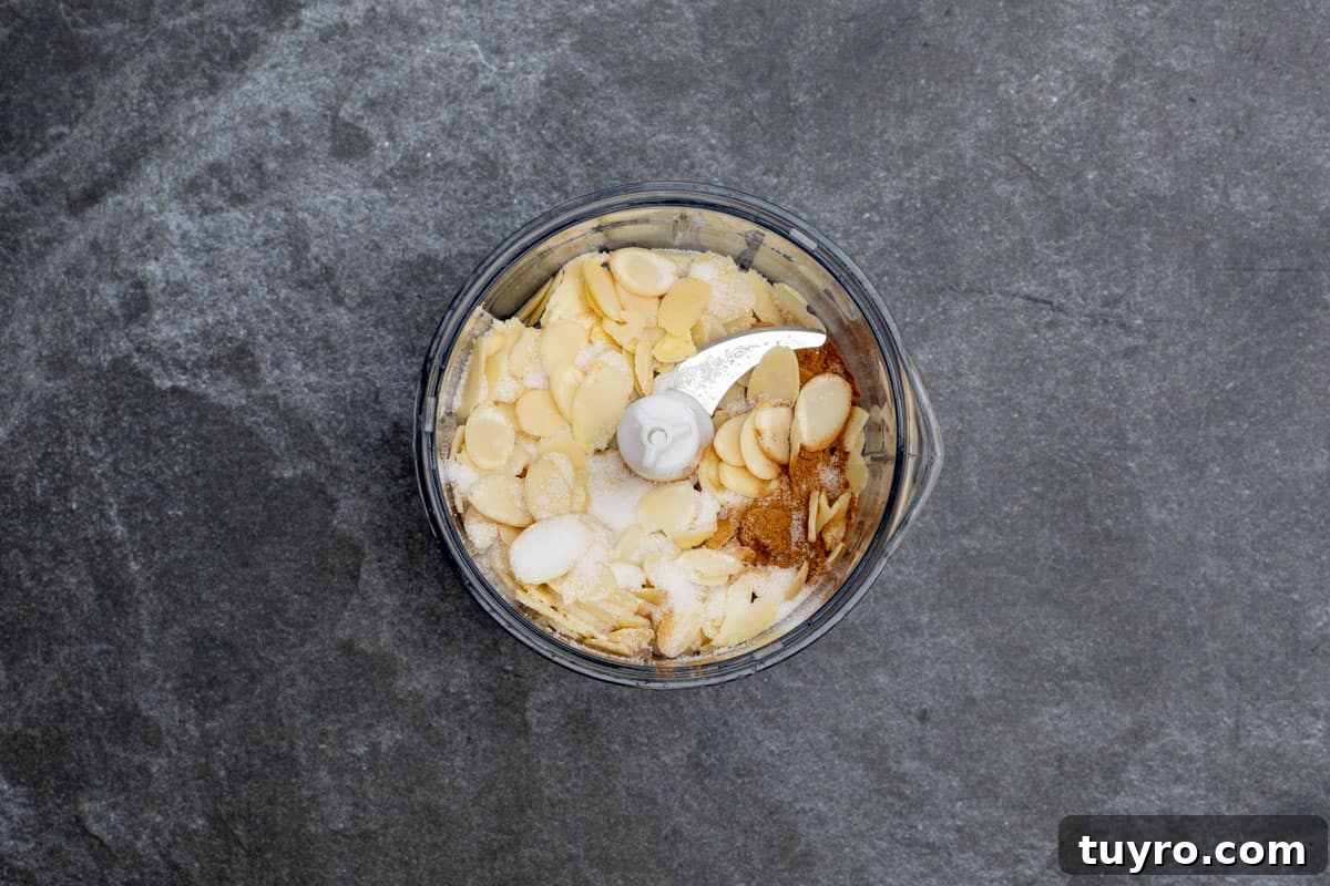 Moist Apple Almond Cake Recipe with Cinnamon 4 mini food processor with almonds, butter, sugar, and cinnamon