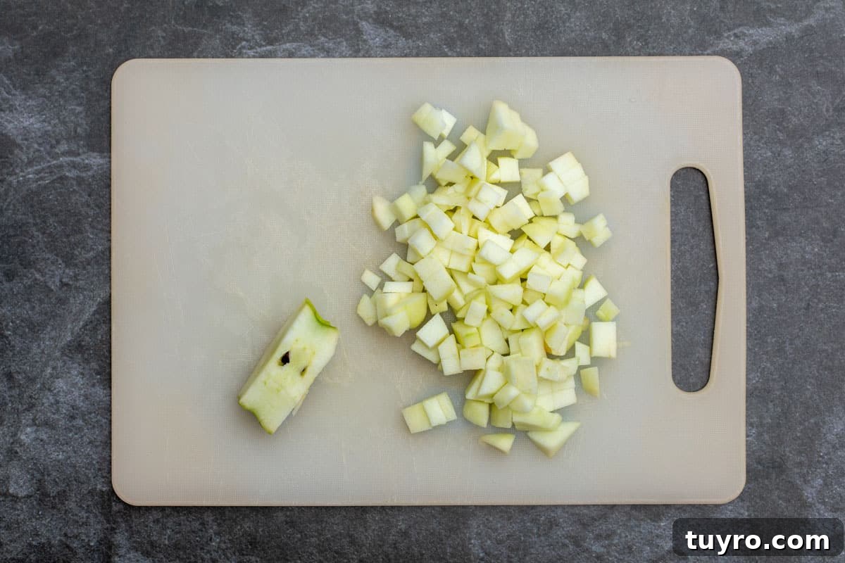 Moist Apple Almond Cake Recipe with Cinnamon 5 chopped apples on cutting board