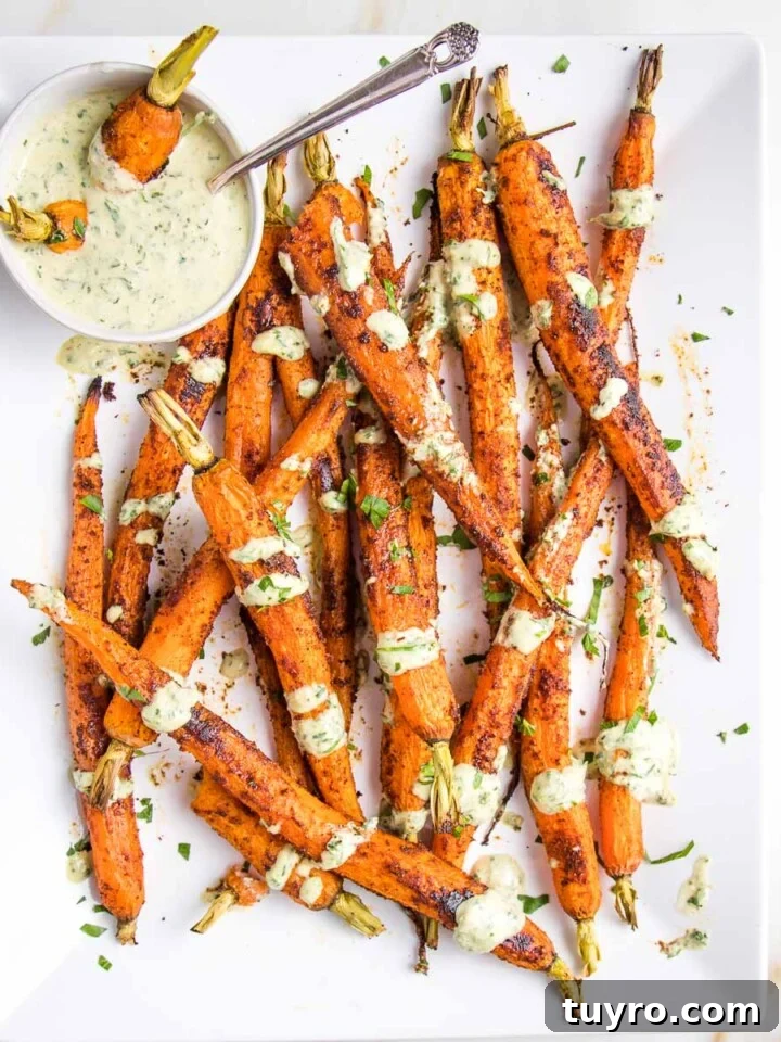 Whole roasted and spiced carrots with tahini sauce.