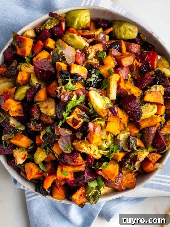 Bowl with roasted cubes of root vegetables.