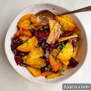 Wedges of whole roasted golden beets and red beets with balsamic, sea salt and chopped fresh parsley.