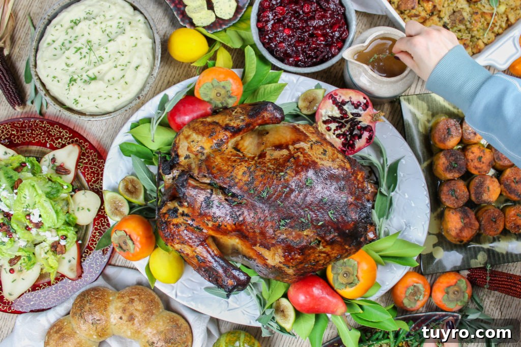 Thanksgiving Table Settings and Centerpiece Ideas 5 thanksgiving table with turkey, salad, potatoes, cranberry sauce, stuffing