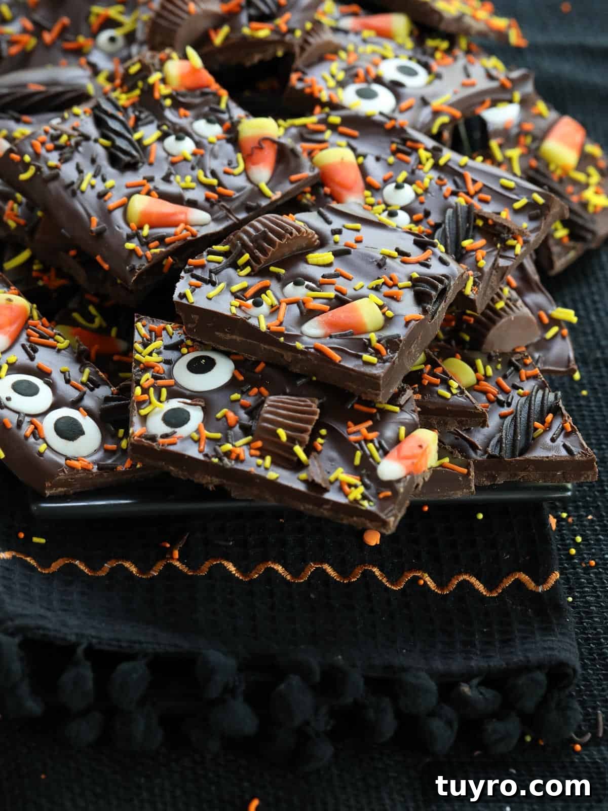 Halloween bark made from chocolate, candy, and sprinkles with candy eyeballs for a treat.