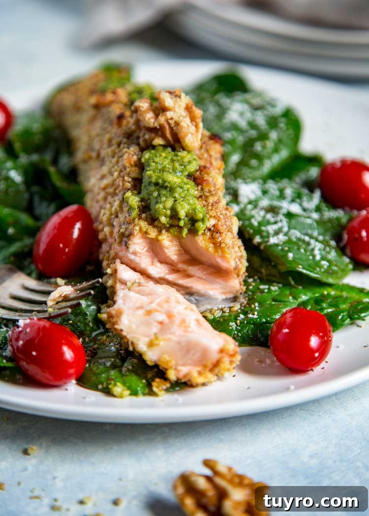 For my Walnut Crusted Pesto Salmon I pressed fresh, chopped California Walnuts on all sides and topped the baked salmon with a homemade walnut pesto instead of the traditional pine nuts. Tender and flakey, this salmon is baked, quick and on the table in under 30 minutes. Walnut Crusted Pesto Salmon