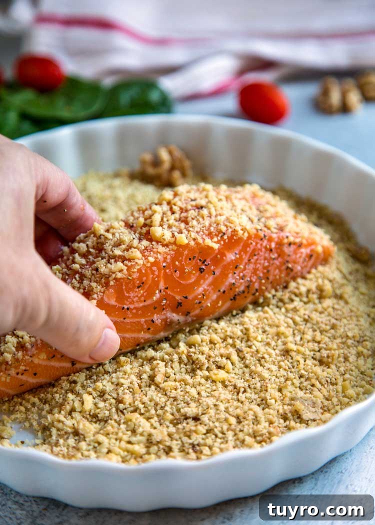 For my Walnut Crusted Pesto Salmon I pressed fresh, chopped California Walnuts on all sides and topped the baked salmon with a homemade walnut pesto instead of the traditional pine nuts. Tender and flakey, this salmon is baked, quick and on the table in under 30 minutes. Walnut Crusted Pesto Salmon