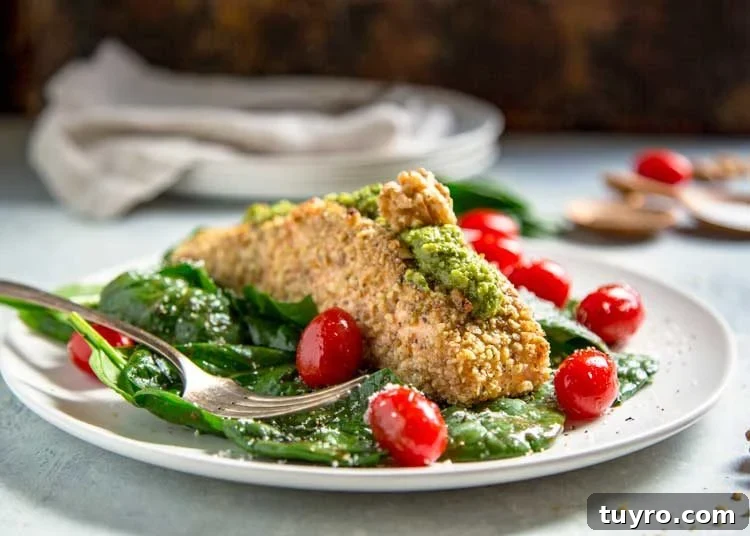 For my Walnut Crusted Pesto Salmon I pressed fresh, chopped California Walnuts on all sides and topped the baked salmon with a homemade walnut pesto instead of the traditional pine nuts. Tender and flakey, this salmon is baked, quick and on the table in under 30 minutes. Walnut Crusted Pesto Salmon