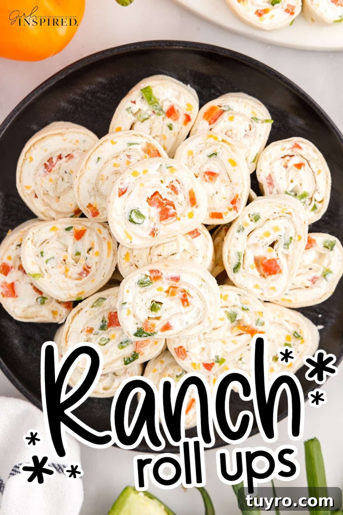 Creamy Ranch Pinwheel Appetizers for Parties and Potlucks 2 Ranch Pinwheels on a black plate with text overlay.