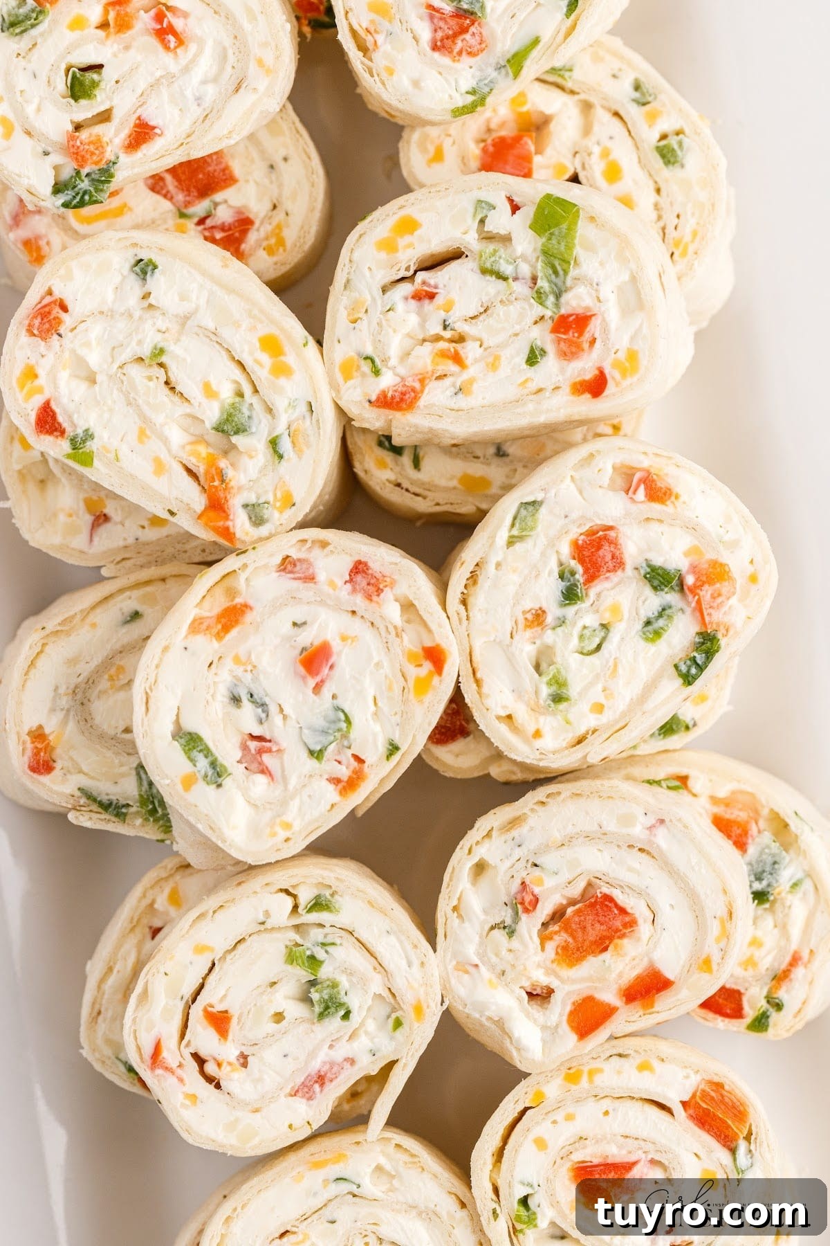 Creamy Ranch Pinwheel Appetizers for Parties and Potlucks 10 Overhead view of Ranch Pinwheels on an rectangular platter.