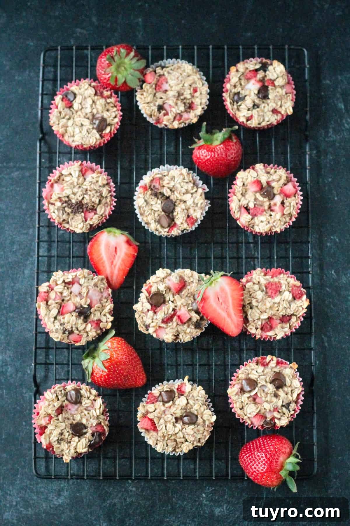 Strawberry Baked Oatmeal Muffins Recipe for Moist Breakfast Bites 8 Twelve strawberry baked oatmeal muffins on a cooling rack.