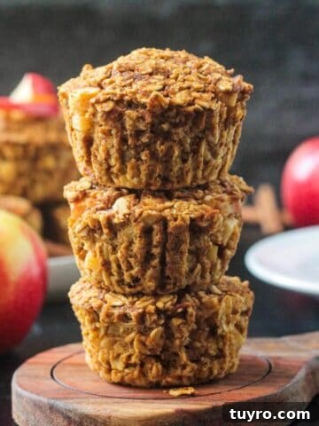 Three baked oat cups in a stack.