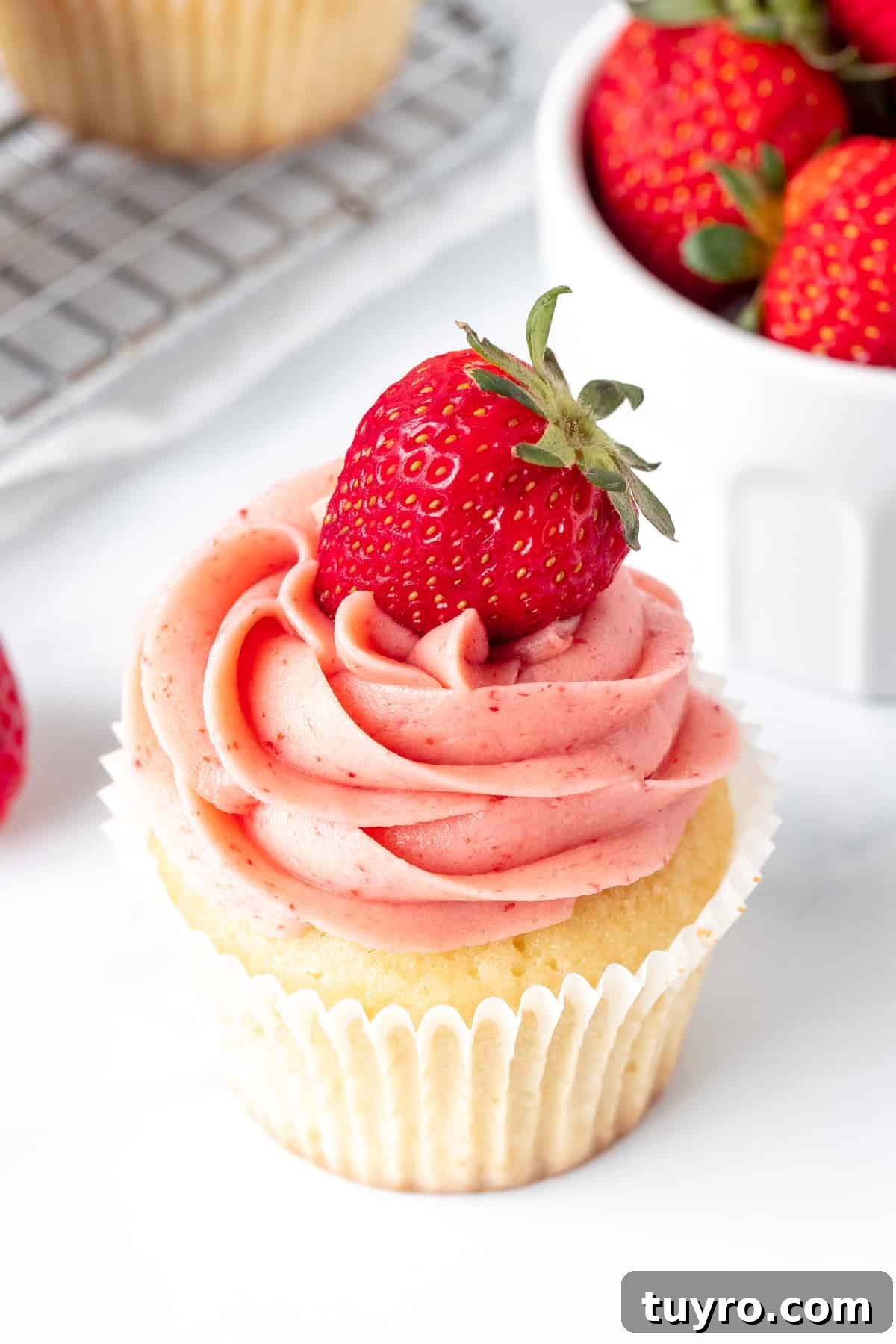 Strawberry Buttercream Frosting Made with Fresh or Frozen Berries 2 Vanilla cupcake with strawberry buttercream frosting