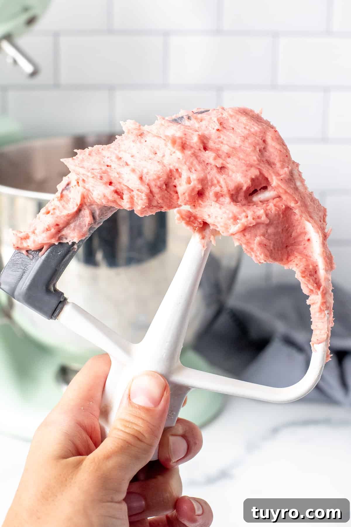 Strawberry Buttercream Frosting Made with Fresh or Frozen Berries 5 Strawberry frosting on electric beater