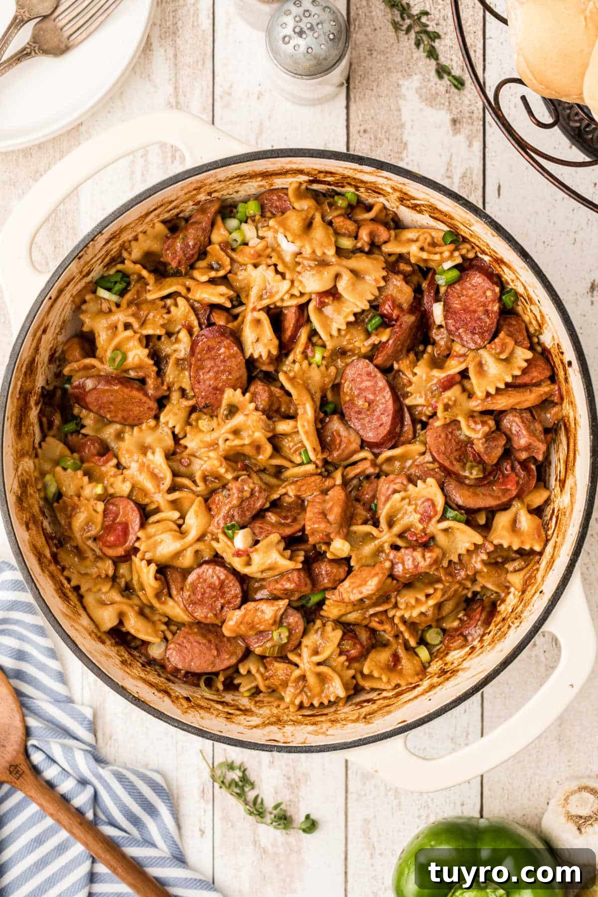 Overhead shot of a pot full of pastalaya with a spoon on the side.