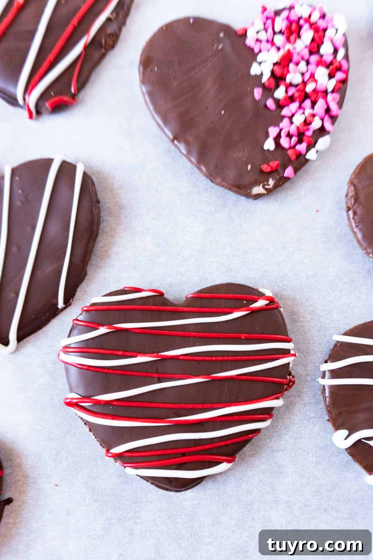 Chewy Chocolate-Cherry Cookies Recipe 6 cookie with red and black strips and another with sprinkles