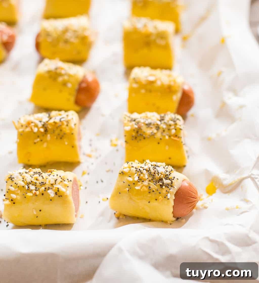 Puff Pastry wrapped hot dogs topped with egg wash and everything bagel seasoning