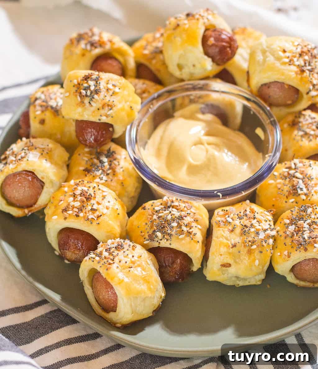 Cooked Pigs in a Blanket topped with everything bagel seasoning
