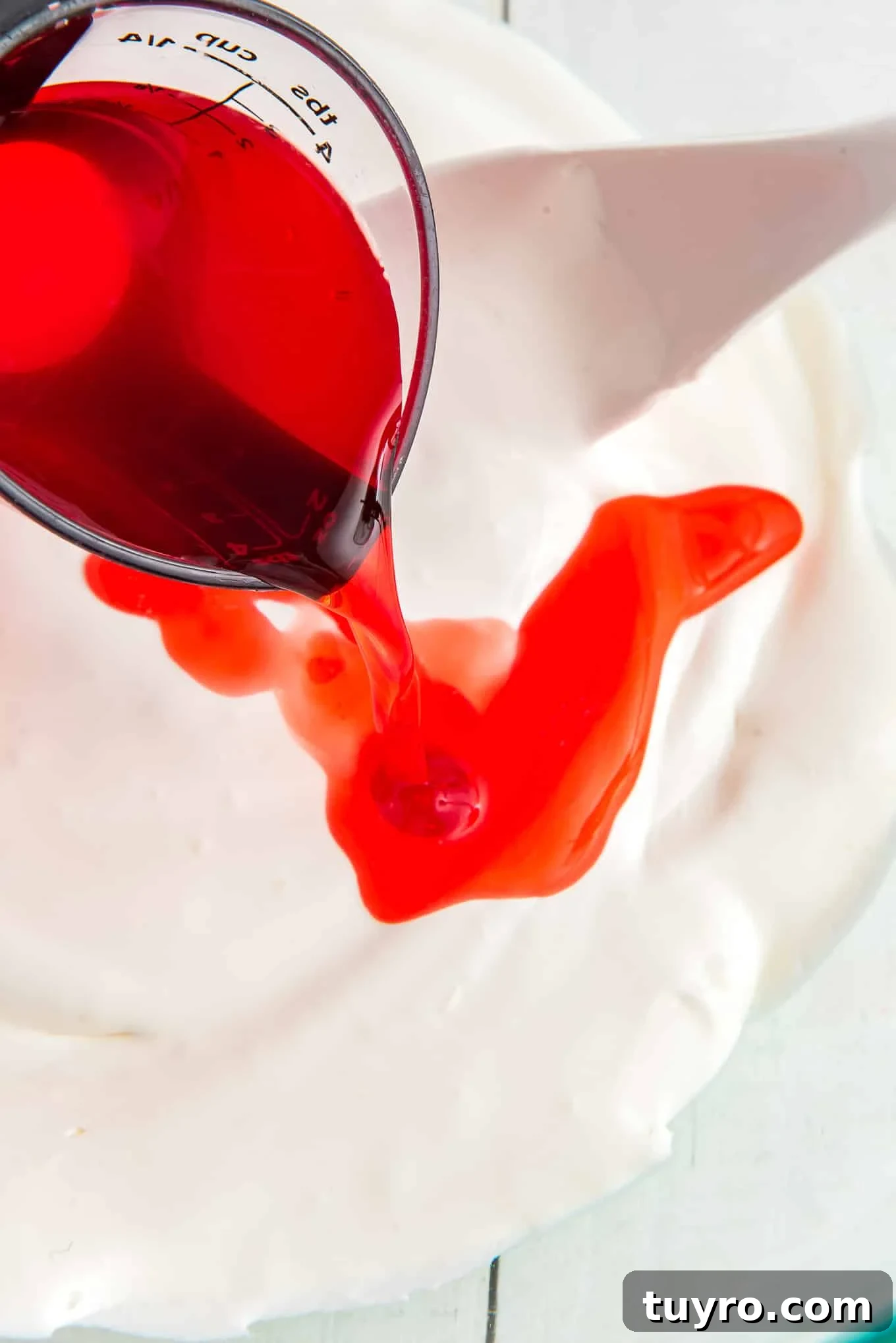 Creamy Fruit Salad with Whipped Topping for Parties 4 Mixing the cherry juice with the whipped topping.