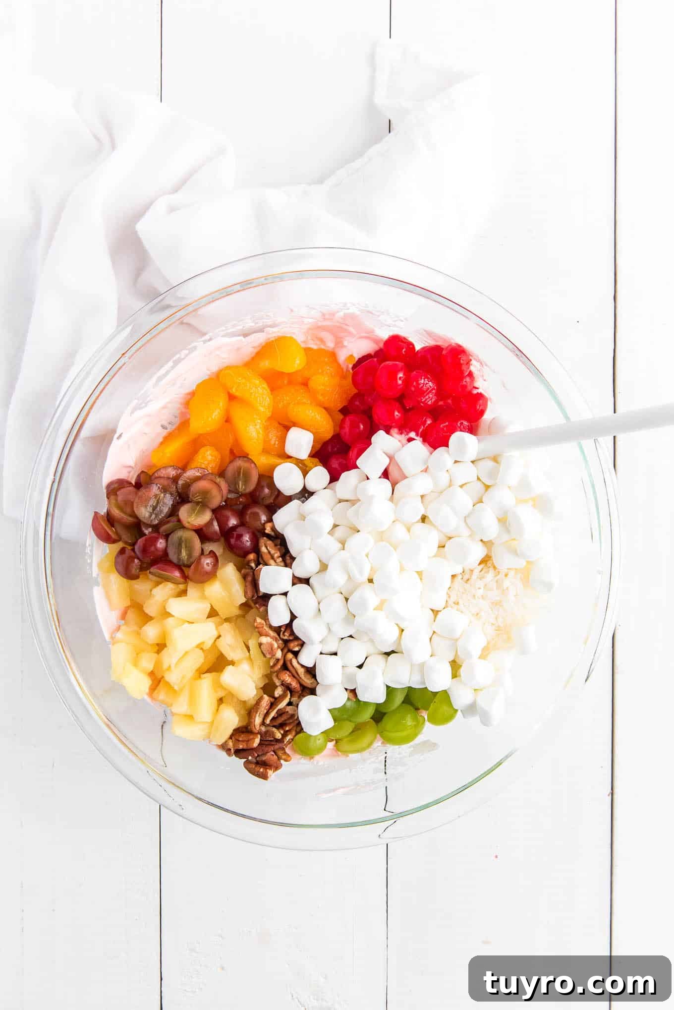 Creamy Fruit Salad with Whipped Topping for Parties 5 All the fruits, nuts and pecans in a bowl.