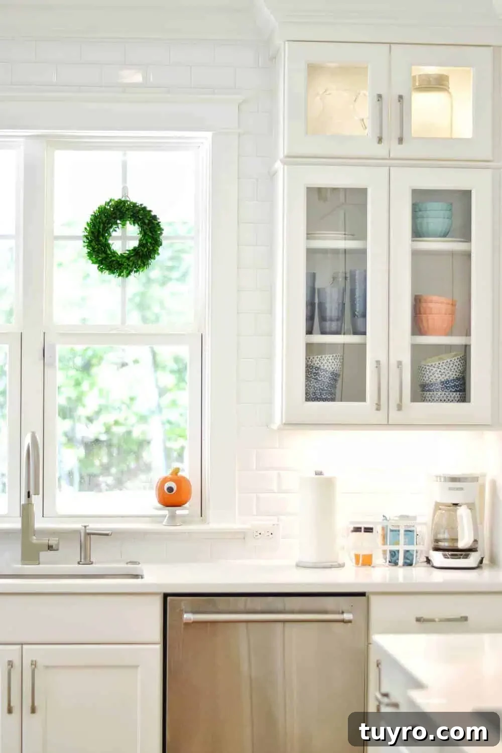 Affordable Fall and Halloween Home Tour: Stylish Seasonal Decor on a Budget 15 cheap wreath in the window with a pumpkin