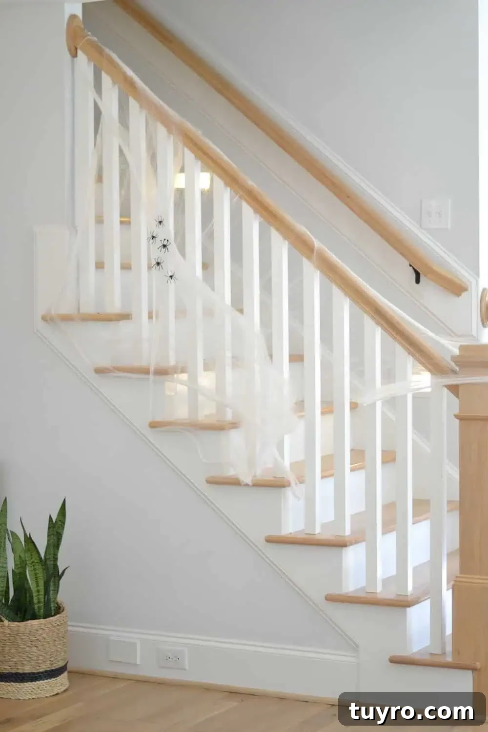 Affordable Fall and Halloween Home Tour: Stylish Seasonal Decor on a Budget 17 spiderwebs on the stairs are cheap