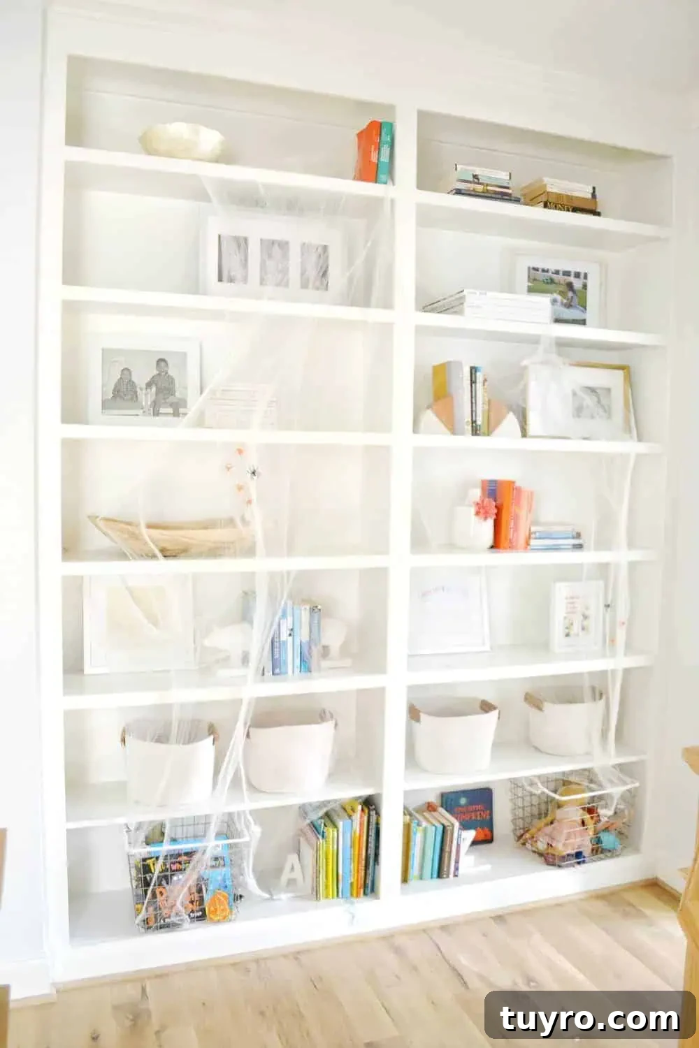 Affordable Fall and Halloween Home Tour: Stylish Seasonal Decor on a Budget 18 spiderwebs on bookshelves