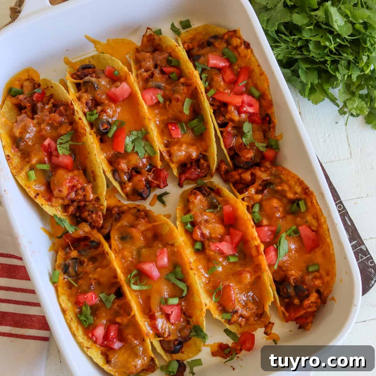 30 Taco Tuesday Ideas for a Craveworthy Dinner 12 Chicken tacos baked in a white casserole dish