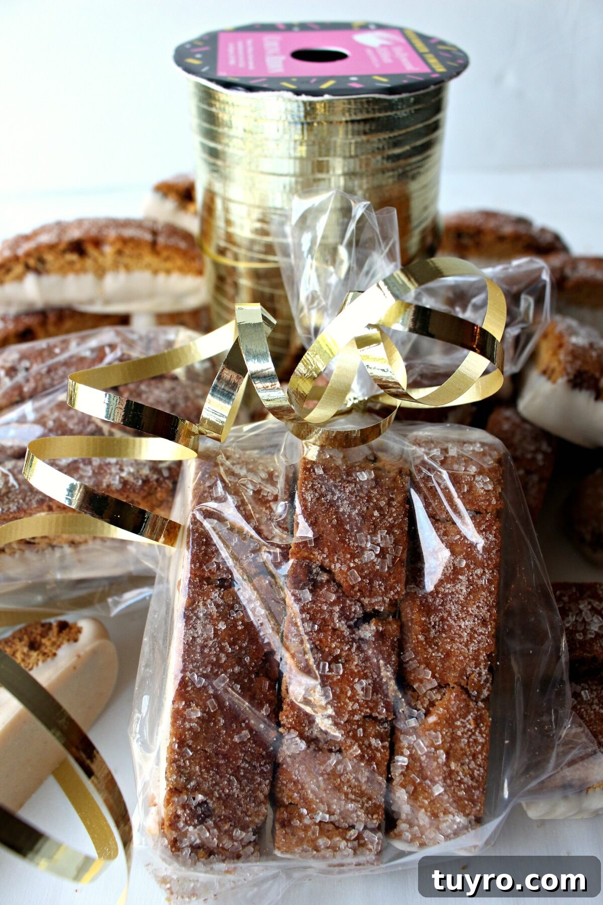 Cinnamon Chip Biscotti Recipe: Crispy Twice-Baked Cookies 6 Biscotti wrapped for gifting in cellophane bags tied with gold ribbon.