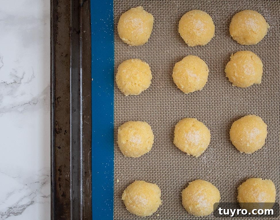 Keto Low‑Carb Sugar Cookie Macaroons – Soft Almond Macaroon Recipe 7 keto macaroons in a silicone baking mat on a baking sheet