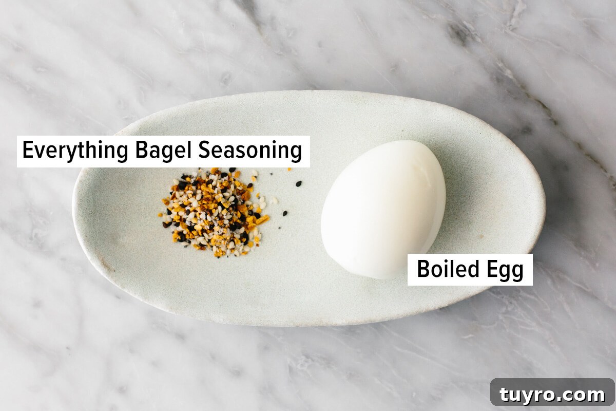 Hard boiled egg snack with seasoning Hard boiled egg and bagel seasoning on a plate