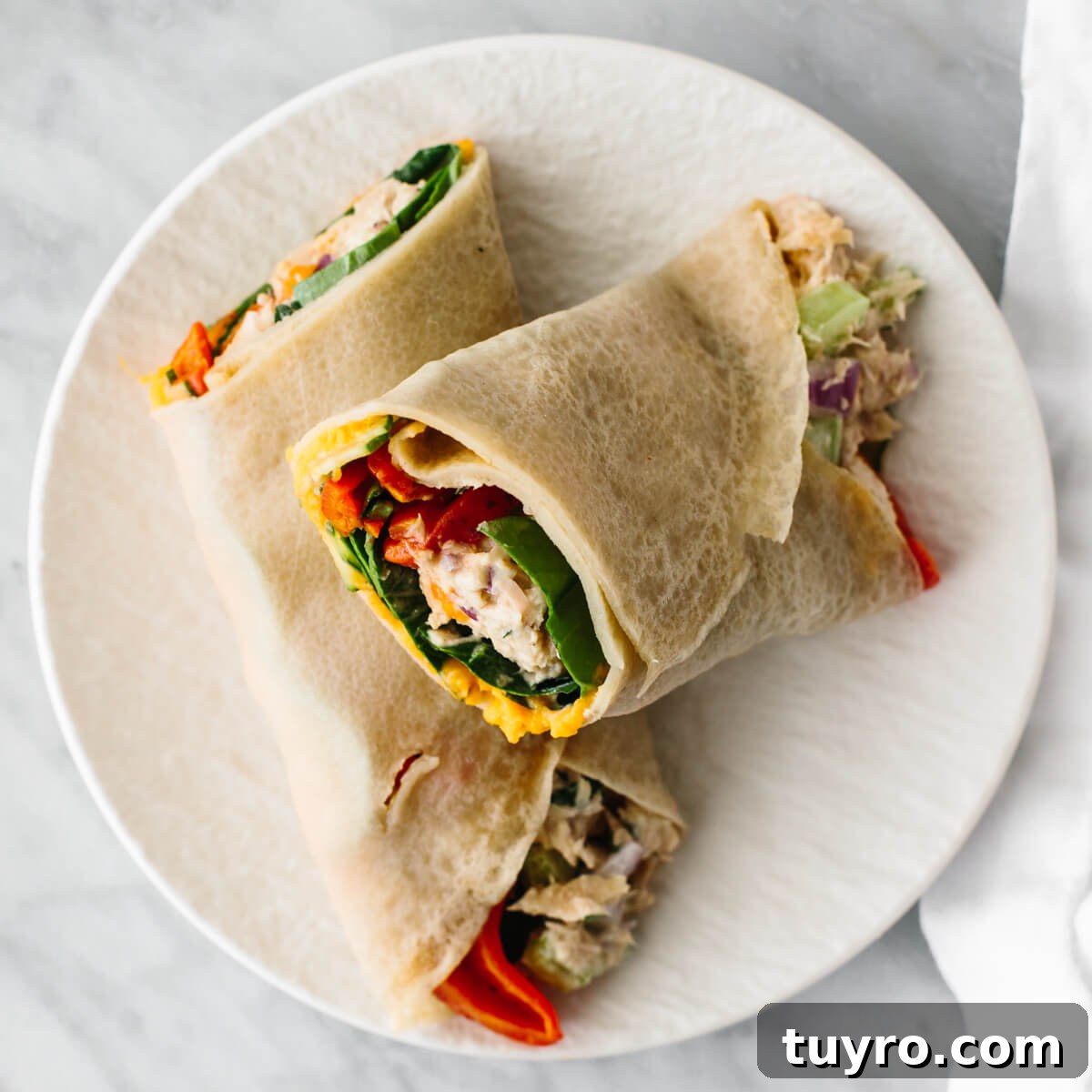 Tuna salad wrap for affordable meal prep Tuna salad wrap on a plate for a budget meal prep