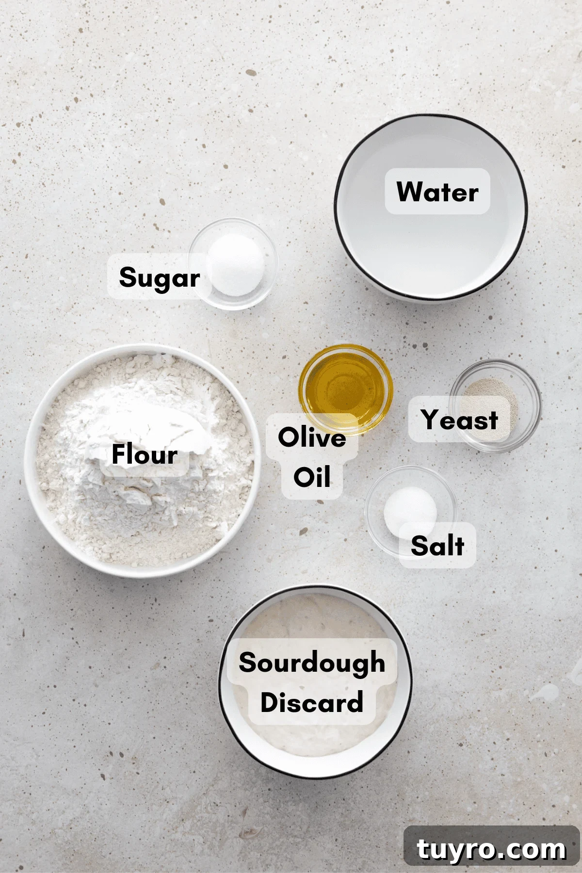 Ingredients for Sourdough Discard Pizza Dough in small bowls. 