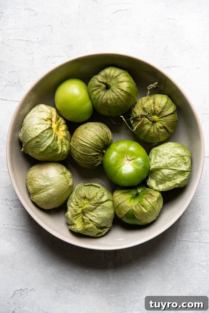 Smoky Roasted Tomatillo Salsa Verde Recipe 3 tomatillos in a bowl.