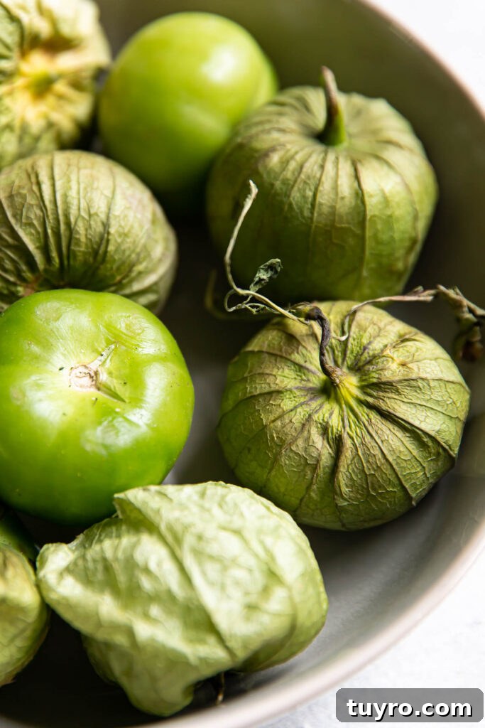 Smoky Roasted Tomatillo Salsa Verde Recipe 4 tomatillos in a bowl.