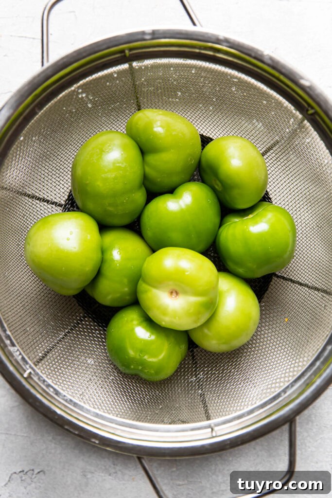 Smoky Roasted Tomatillo Salsa Verde Recipe 6 clean tomatillos in a collander.