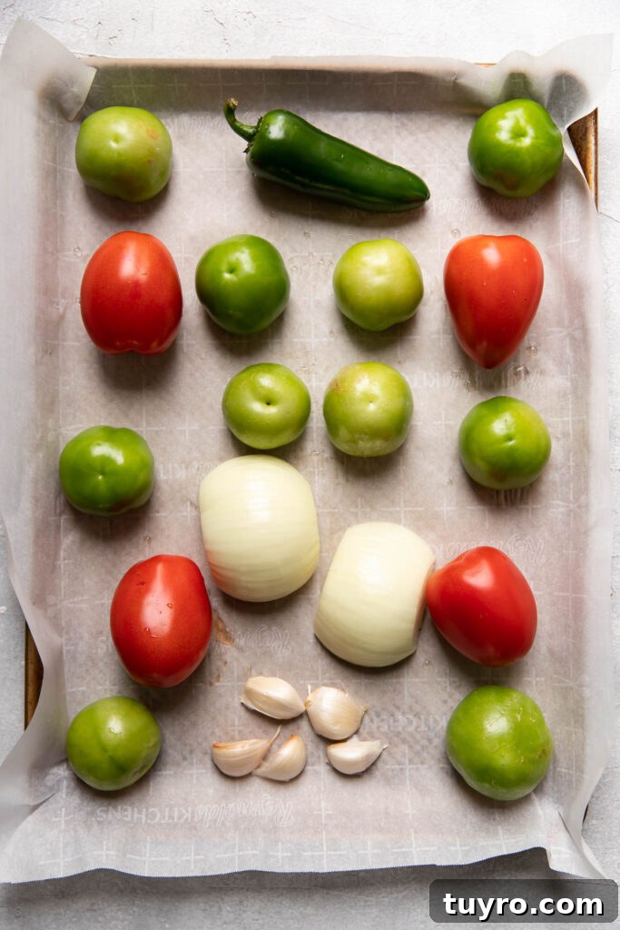 Smoky Roasted Tomatillo Salsa Verde Recipe 7 vegetables on a sheet pan.
