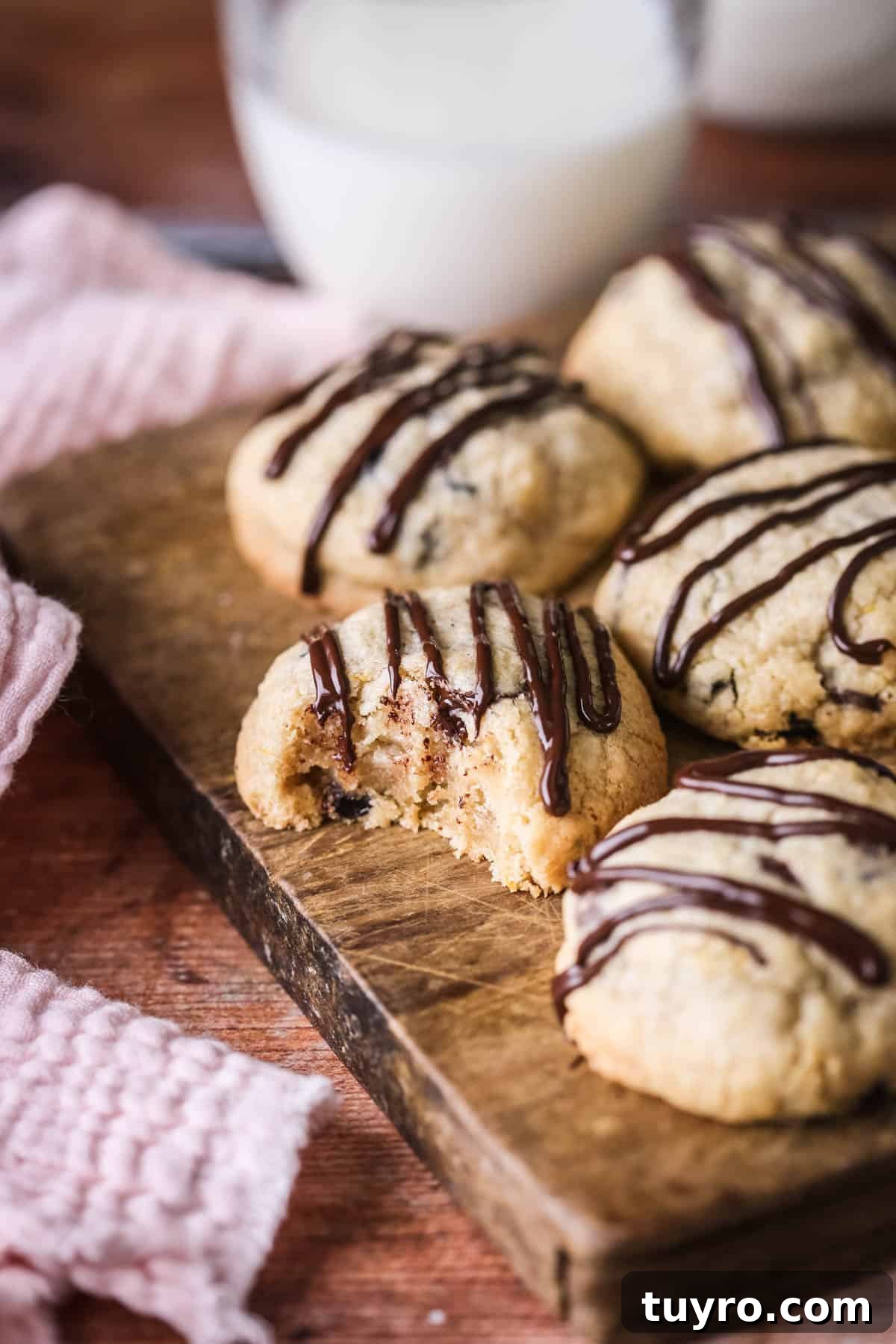 Gluten-Free Easter Cookie Recipes for Spring Baking 11 Bite taken out of Easter Cookie showing soft slightly chewy centre packed with fillings.