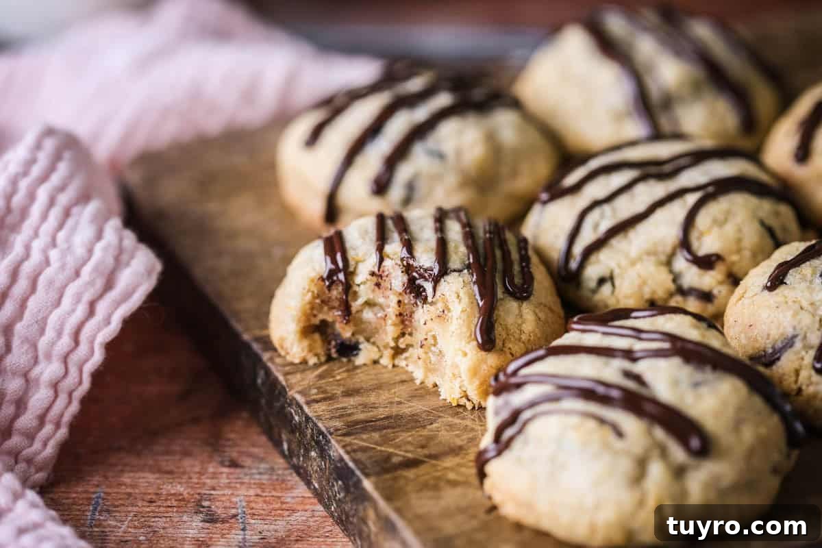 Gluten-Free Easter Cookie Recipes for Spring Baking 3 Bite taken out of Easter Cookie showing soft slightly chewy centre packed with fillings.