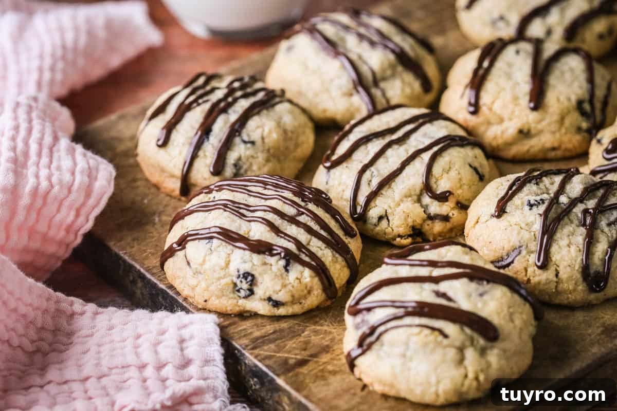 Gluten-Free Easter Cookie Recipes for Spring Baking 5 Easter Cookies packed with marzipan, currants, spice and chocolate resting on a wooden board.
