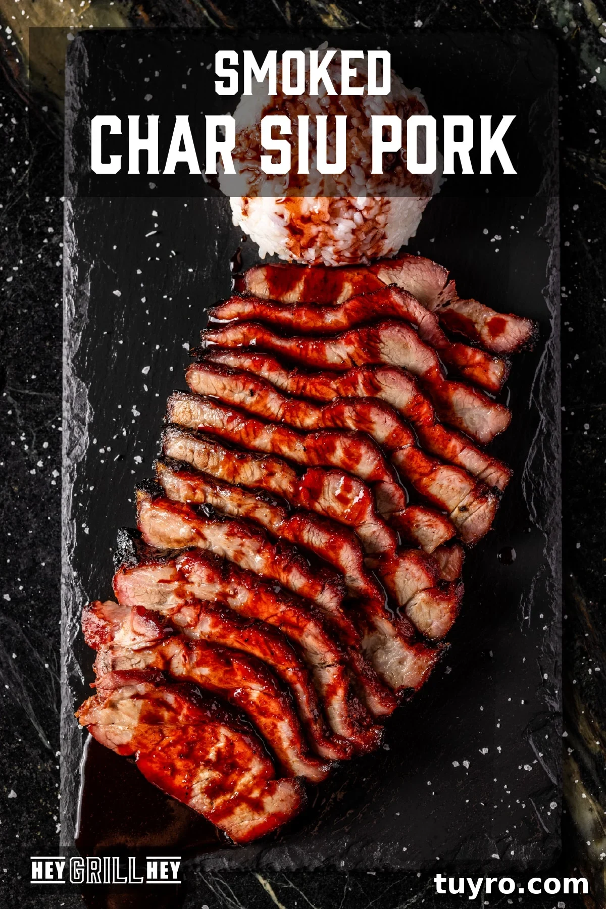 Authentic Cantonese Char Siu Pork Recipe: Smoky Oven-Roasted BBQ 2 Slices of pork char siu shingled on a black patter and drizzled with BBQ sauce. The text overlay reads "Smoked Char Siu Pork" at the top, and "Hey Grill Hey" at the bottom.