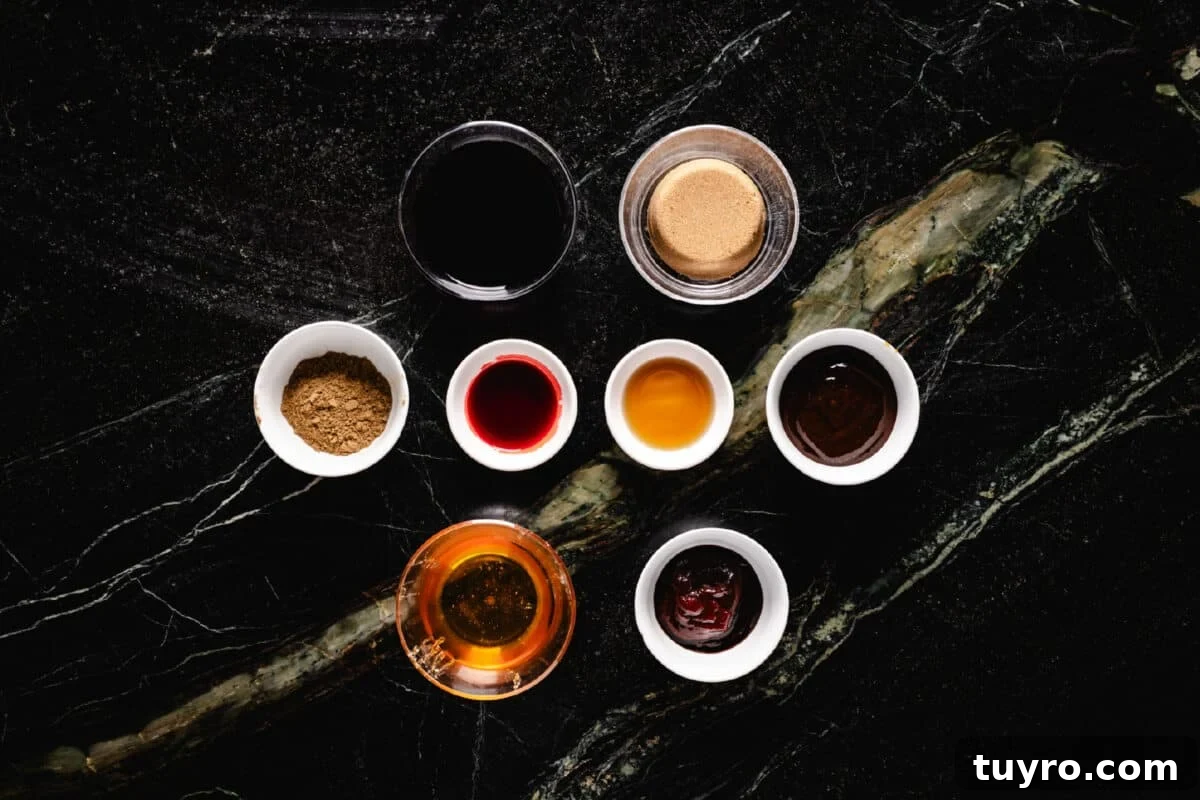 Authentic Cantonese Char Siu Pork Recipe: Smoky Oven-Roasted BBQ 3 An overhead shot of 8 glass bowls in rows of 2, 4, and 2 filled with individual ingredients for a sauce.