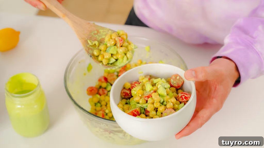 Scooping chickpea salad