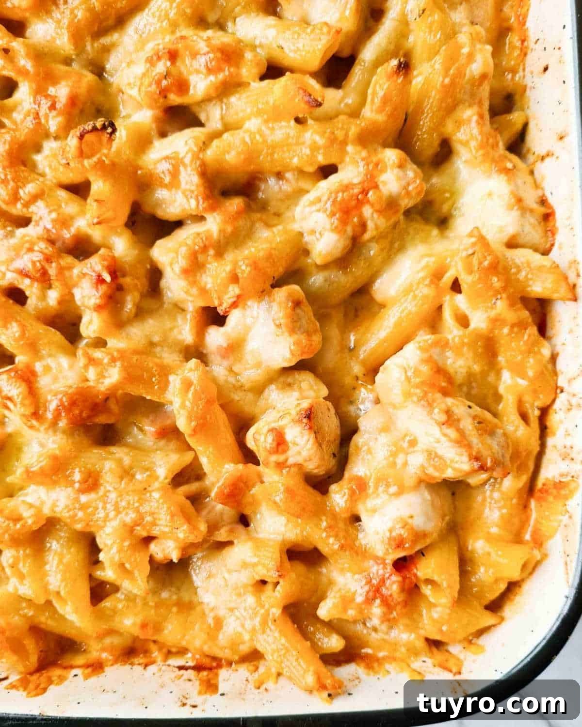 Creamy Chicken & Bacon Pasta Bake Recipe for Weeknight Dinners 8 Close up of baked golden cheese on top of the pasta