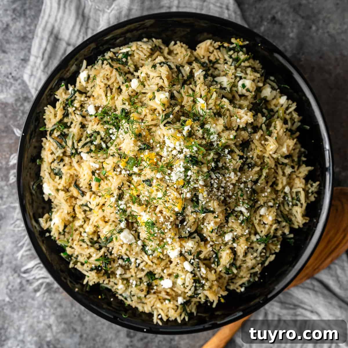 overhead: Greek dish of spanakorizo served in black bowl