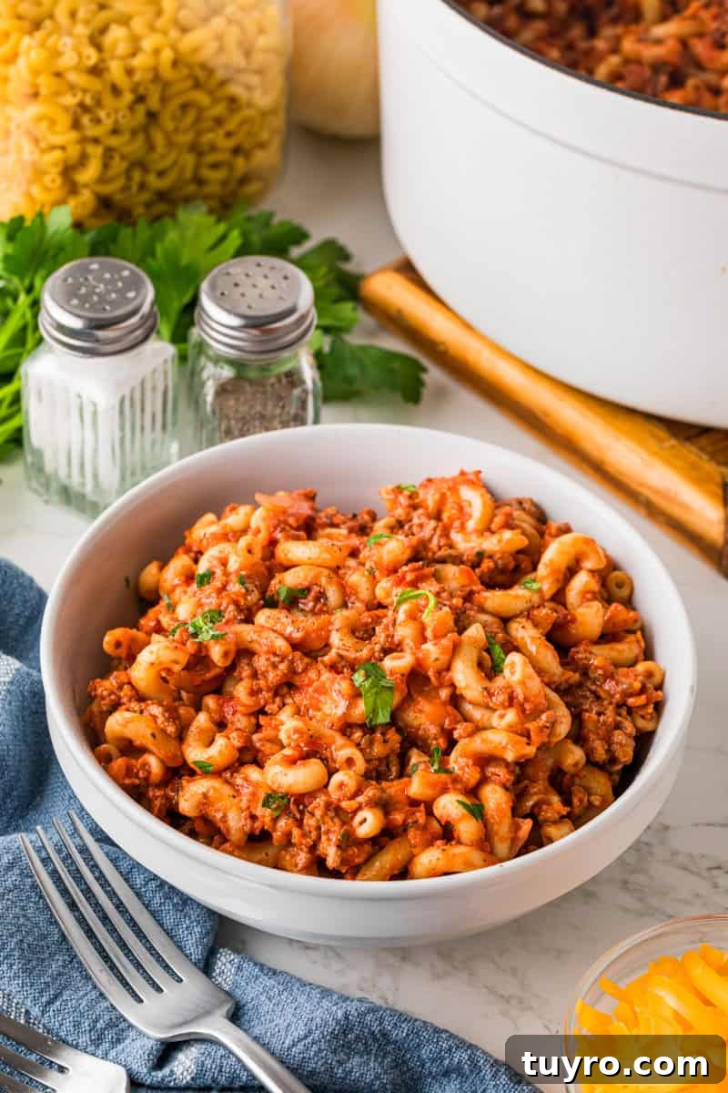 Homemade Beefaroni: Savory One-Pot Pasta Recipe 12 beefaroni served in a white bowl.